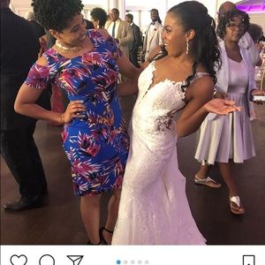 Beautiful lace layered wedding dress with moderate length train. See pictures